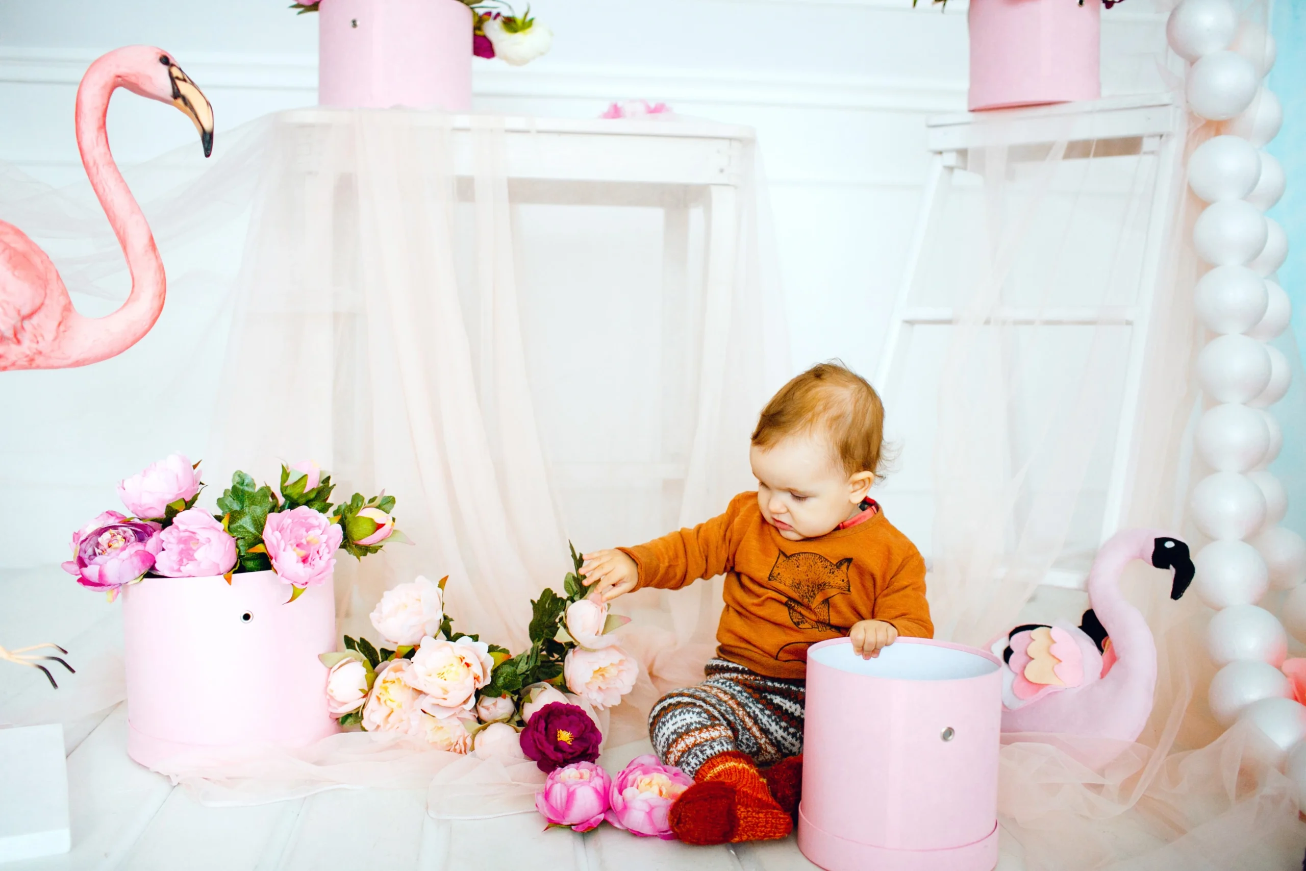 girl-plays-with-flowers-pink-box-celebration-hive